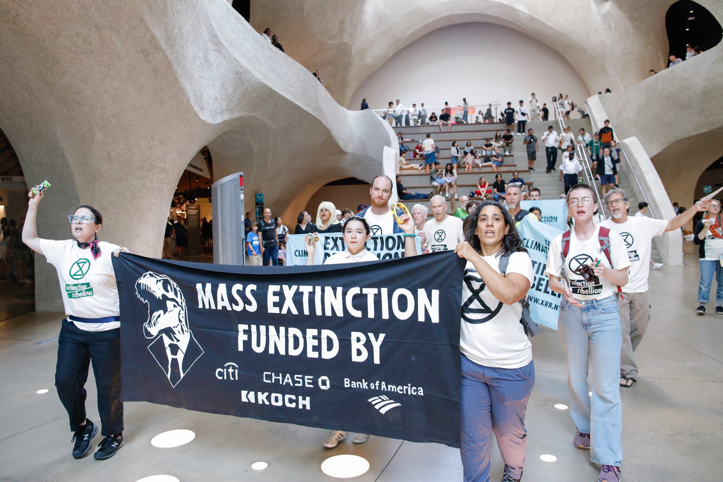 Extinction Rebellion activists protest inside the Museum of Natural History in New York City on Aug. 18, 2024. Credit: Kena Betancur/AFP via Getty Images