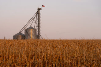 A grain bin stands in a corn field in Marne, Iowa. Credit: Bill Clark/CQ-Roll Call, Inc via Getty Images
