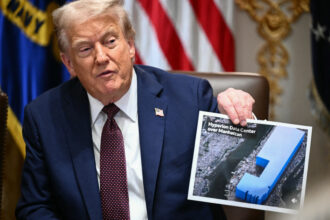 President Donald Trump holds an image showing the size of a proposed Meta data center during a cabinet meeting at the White House on Aug. 26, 2025. Credit: Mandel Ngan/AFP via Getty Images