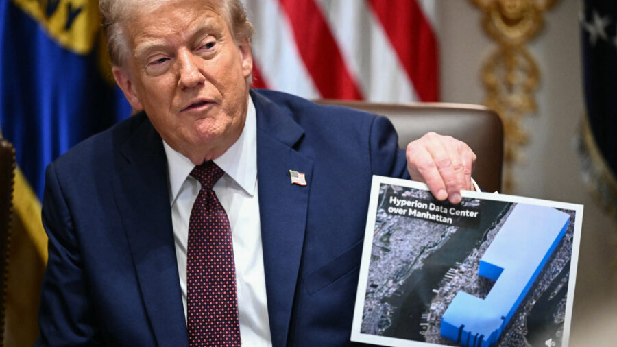 President Donald Trump holds an image showing the size of a proposed Meta data center during a cabinet meeting at the White House on Aug. 26, 2025. Credit: Mandel Ngan/AFP via Getty Images