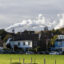 Homes and a hotel sit in front of a steel factory in Wijk aan Zee, Netherlands. Credit: Michel Porro/Getty Images