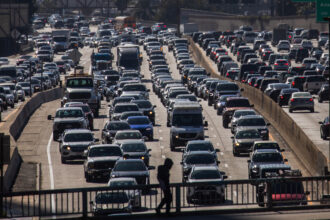 Heavy traffic is seen on Interstate 110 in Los Angeles on Feb. 13. Tim Whitehouse, executive director of Public Employees for Environmental Responsibility, said the EPA has stopped enforcing the Clean Air Act under the second Trump administration. Credit: Apu Gomes/Getty Images