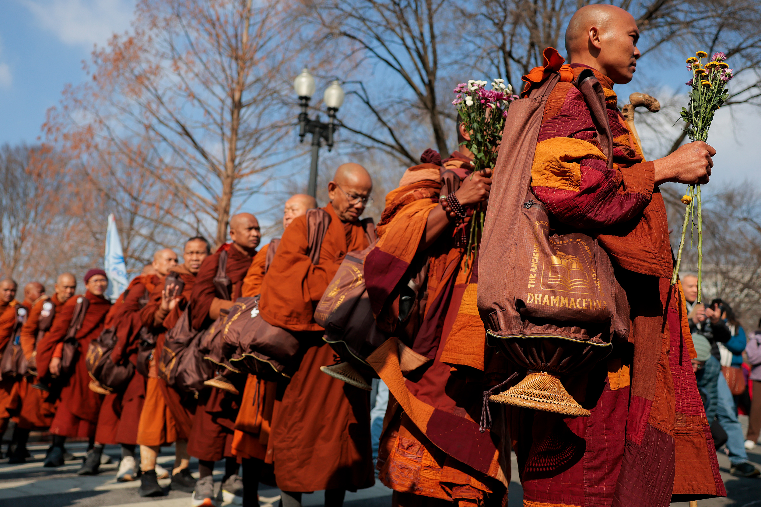 Buddhist monks line up during their March for Peace at the Peace Monument to greet U.S. Congress members on day 109 of their journey on Feb. 11 in Washington, D.C. Credit: Heather Diehl/Getty Images