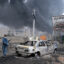 Plumes of smoke rise over the oil depot tanks hit by overnight attacks on March 8 in Tehran, Iran. Credit: Kaveh Kazemi/Getty Images