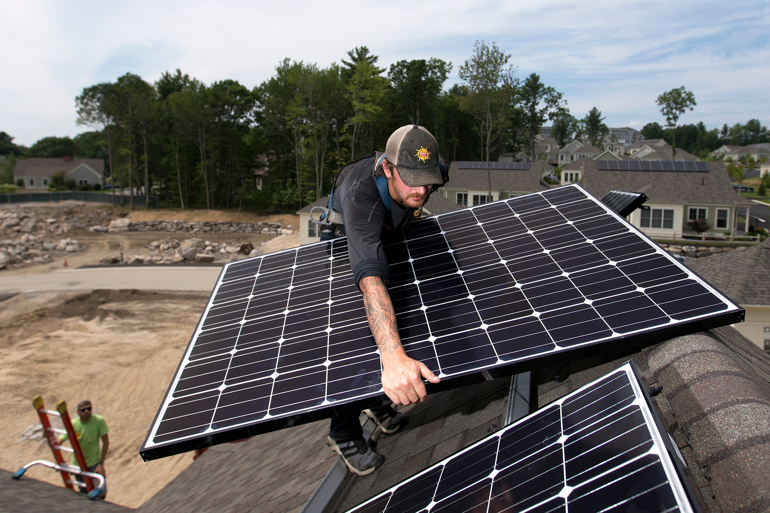Solar panels are installed on the roof of a home in Falmouth, Maine. Credit: Ben McCanna/Portland Portland Press Herald via Getty Images