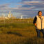 Elida Castillo, an environmental organizer from San Patricio County, stands outside Exxon’s plastics plant near her family home in 2022. Credit: Dylan Baddour/Inside Climate News