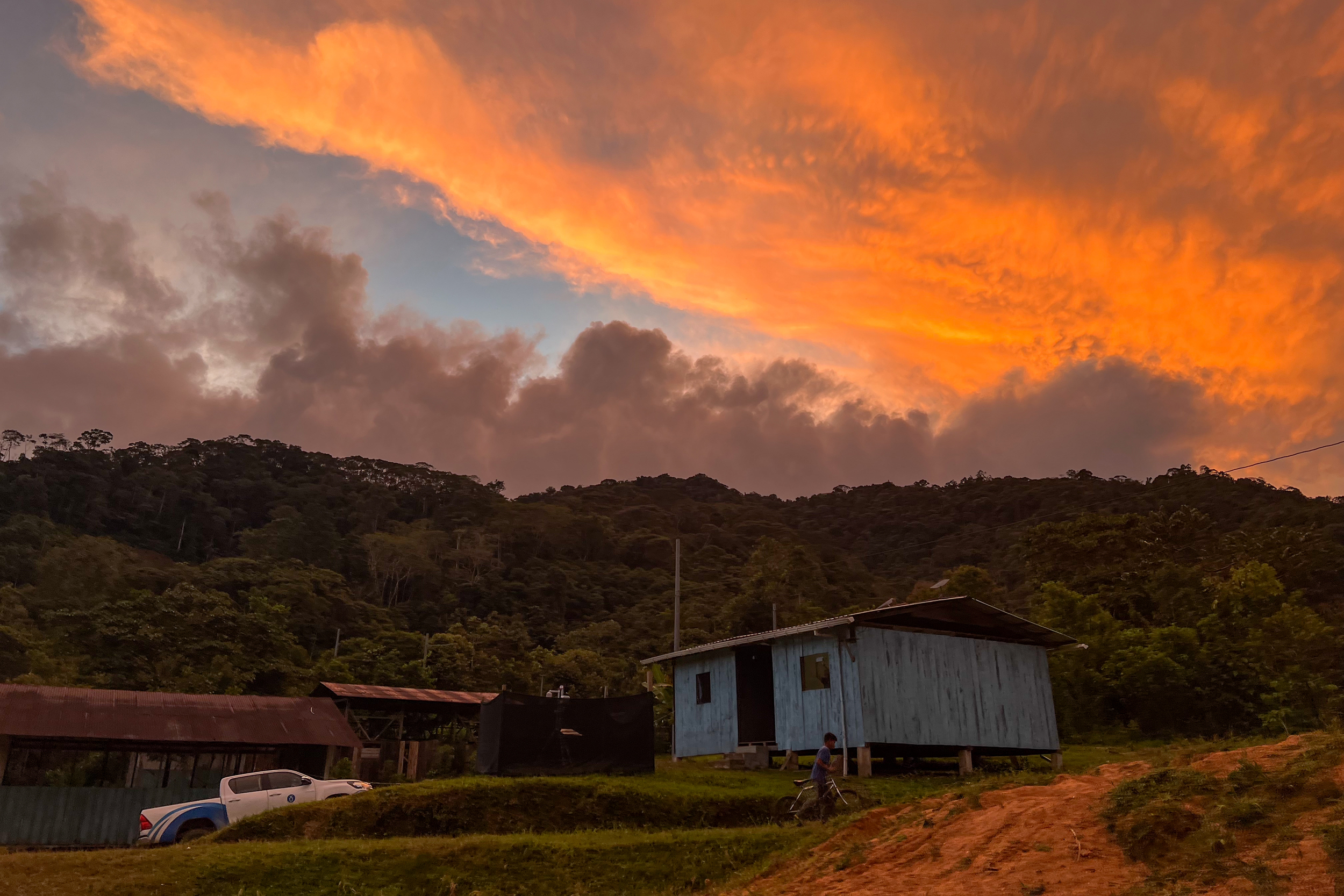 An orange sky hangs over the paraecologist center in the community of Maikiuants on Nov. 29, 2025.