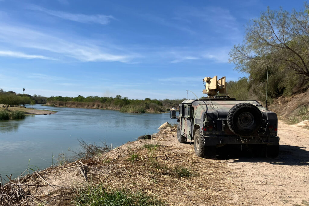 A Humvee is seen parked on the banks of the Rio Grande in Roma, Texas, on Feb. 25. Customs and Border Protection plans to install buoys in this section of the river. Credit: Martha Pskowski/Inside Climate News