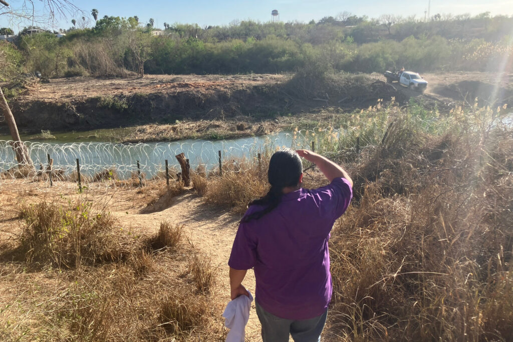 Juan Moreno looks across the Rio Grande to an island that contractors were clearing of vegetation. Credit: Martha Pskowski/Inside Climate News