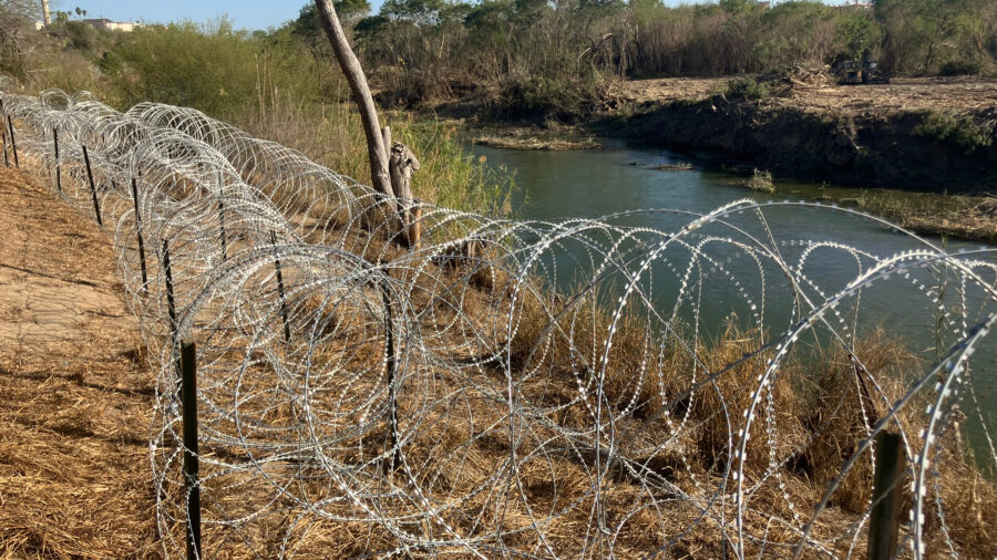 Concertina wire was recently placed along the Rio Grande in Roma, Texas, as contractors clear vegetation along the river. Credit: Martha Pskowski/Inside Climate News