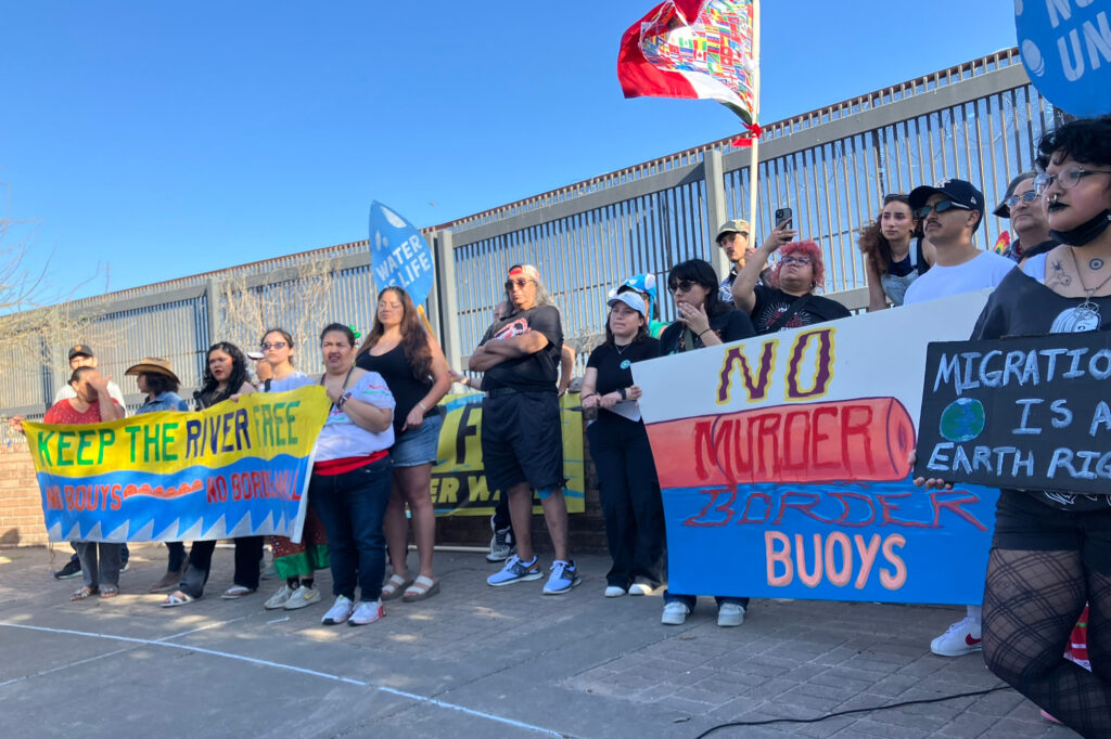During a rally in Brownsville along the border wall on Feb. 26, speakers voiced opposition to border buoys in the Rio Grande. Credit: Martha Pskowski/Inside Climate News