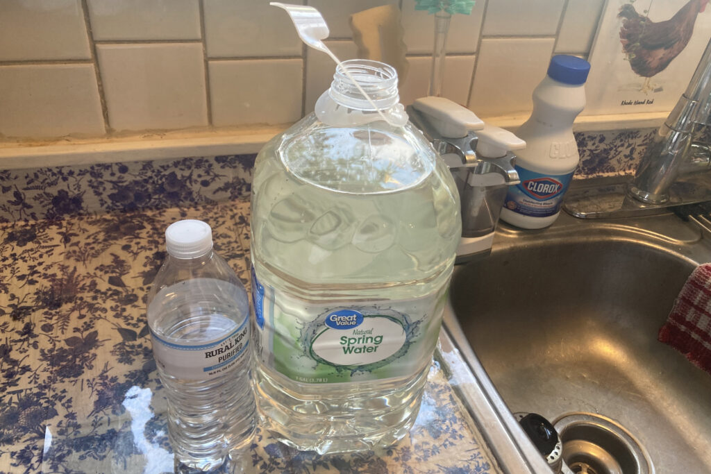 A yellow tinge can be seen in the water in Stacey Greer’s kitchen on Aug. 14, 2025. Credit: Julie Grant/The Allegheny Front