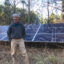 Mark Johnston, a plaintiff in the case, stands with the 6 kW solar array at his Alabama home. Credit: Courtesy of Southern Environmental Law Center