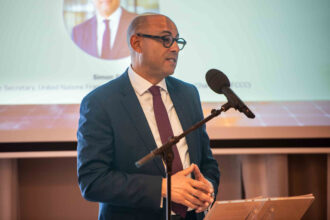 Simon Stiell, executive secretary of the U.N. Framework Convention on Climate Change, speaks during the Green Growth Summit in Brussels on Monday. Credit: Michael Chia/UNFCCC
