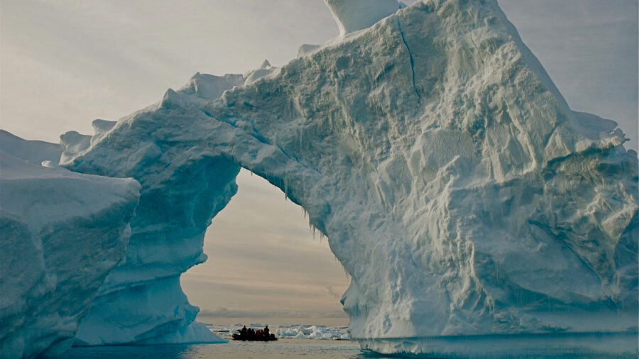 Researchers and tourists explore the edge of an ice shelf along the Antarctic Peninsula, which has warmed faster than nearly any other region in the past few decades. Credit Bob Berwyn/Inside Climate News