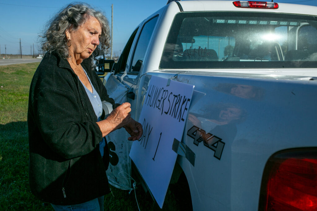 Diane Wilson posts a sign announcing the first day of her hunger strike outside Dow’s Seadrift complex on March 2.