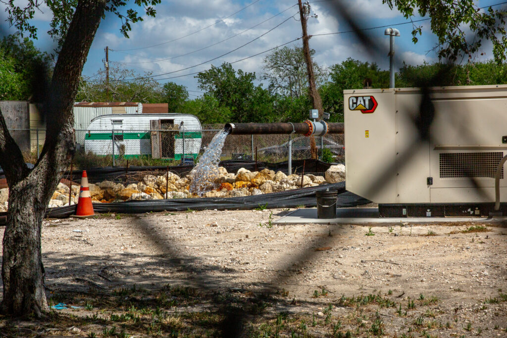 A well at Corpus Christi’s western wellfield pumps water into the Nueces River on March 31. Credit: Dylan Baddour/Inside Climate News