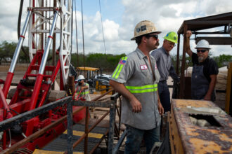 A Weisinger drilling crew makes a pilot hole at the City of Corpus Christi’s eastern wellfield, one of several emergency water projects in the region, on March 31. Credit: Dylan Baddour/Inside Climate News