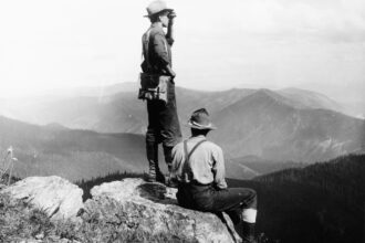 Ranger Griffin and Forest Guard Cameron on fire patrol duty in 1909 from the top of Mount Silcox near Thompson Falls, Mont. Credit: W. J. Lubken/Forest Service