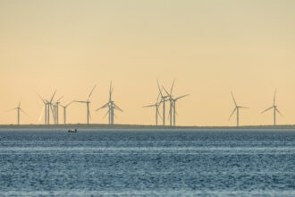 A wind farm is seen on the shore off the Laguna Madre near Port Isabel, Texas. Credit: Jon G. Fuller/VW Pics/Universal Images Group via Getty Images