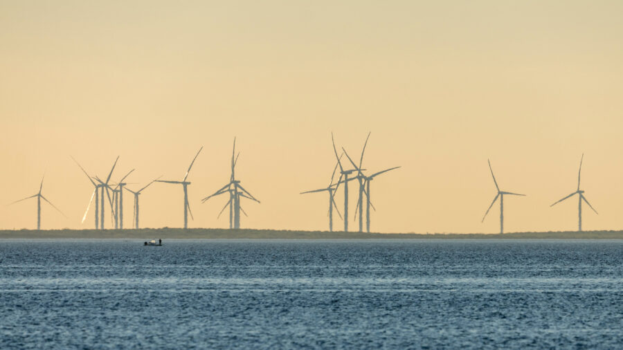 A wind farm is seen on the shore off the Laguna Madre near Port Isabel, Texas. Credit: Jon G. Fuller/VW Pics/Universal Images Group via Getty Images