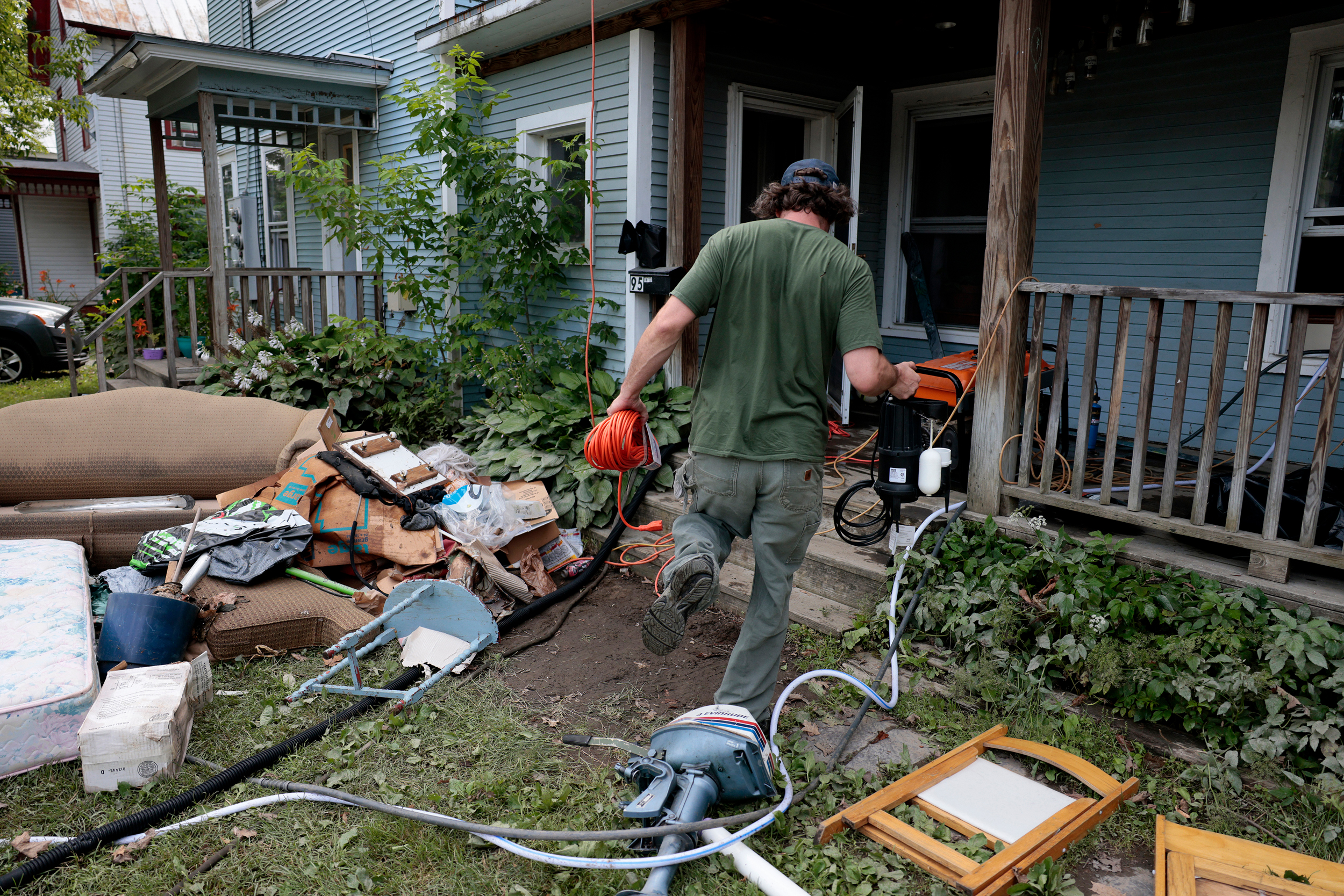 A landlord checks on one of his apartments in the aftermath of historic flooding in Johnson, Vt., on July 12, 2023. Credit: Jessica Rinaldi/The Boston Globe via Getty Images