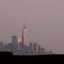 Children play in a park as the skyline of New York City is shrouded by a hazy sky on July 18, 2023. Credit: Gary Hershorn/Getty Images