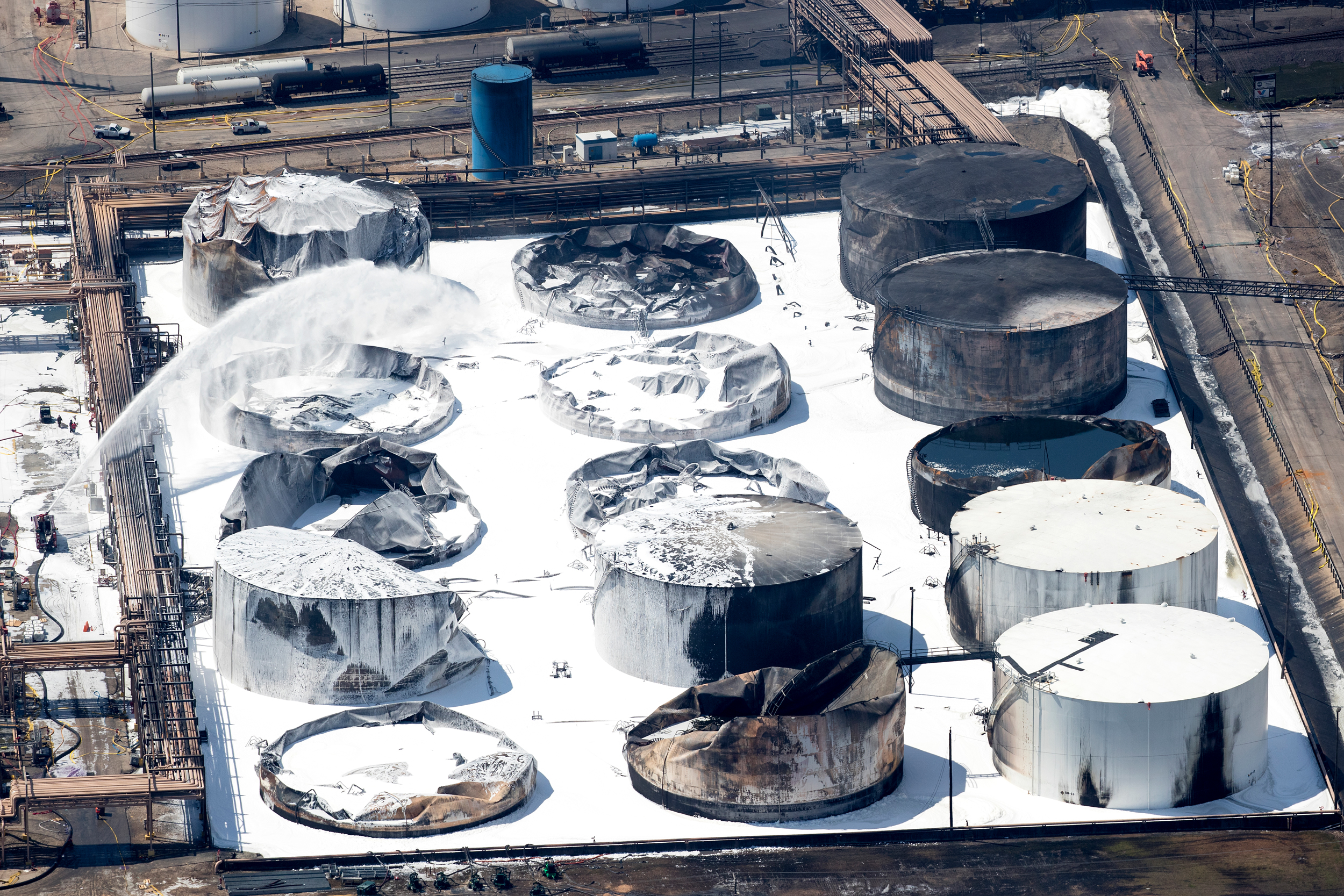 Emergency crews continue to douse what’s left of the extinguished chemical tank fire at Intercontinental Terminals Co. on March 20, 2019, in Deer Park, Texas. Credit: Brett Comer/Houston Chronicle via Getty Images