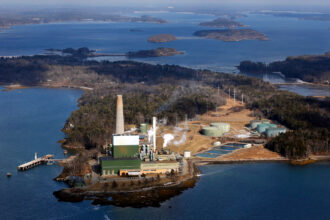An aerial view of the Wyman Power Station, a peaker plant, on Cousins Island in Yarmouth, Maine. Credit: Gabe Souza/Portland Press Herald via Getty Images