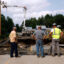 Workers survey the damage after flash floods collapsed a bridge in St. Johnsbury, Vt. Credit: Danielle Parhizkaran/The Boston Globe via Getty Images