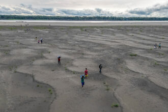 The 2024 El Niño in the Tropical Pacific, combined with human-caused warming, dried out vast tracts of the Amazon region, crushing livelihoods and displacing people, and also flipped some forests to release more carbon dioxide than they absorb and store, a “regime shift” in the Amazon carbon cycle. Credit: Luis Acosta/AFP via Getty Images