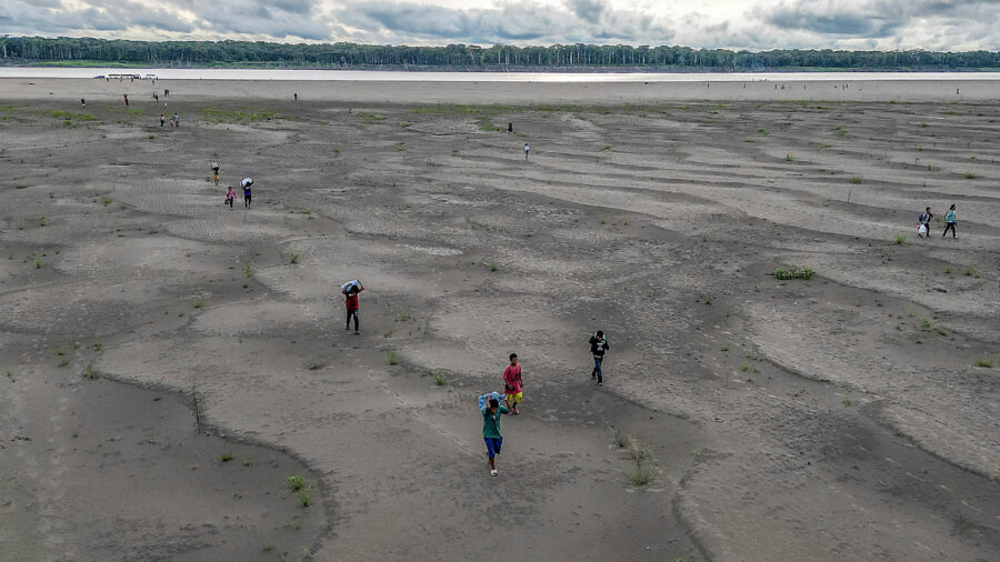 The 2024 El Niño in the Tropical Pacific, combined with human-caused warming, dried out vast tracts of the Amazon region, crushing livelihoods and displacing people, and also flipped some forests to release more carbon dioxide than they absorb and store, a “regime shift” in the Amazon carbon cycle. Credit: Luis Acosta/AFP via Getty Images