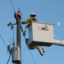 A utility worker with Florida Power & Light services a transformer in Punta Gorda, Fla., on Oct. 12, 2024. Credit: Thomas O'Neill/NurPhoto via Getty Images