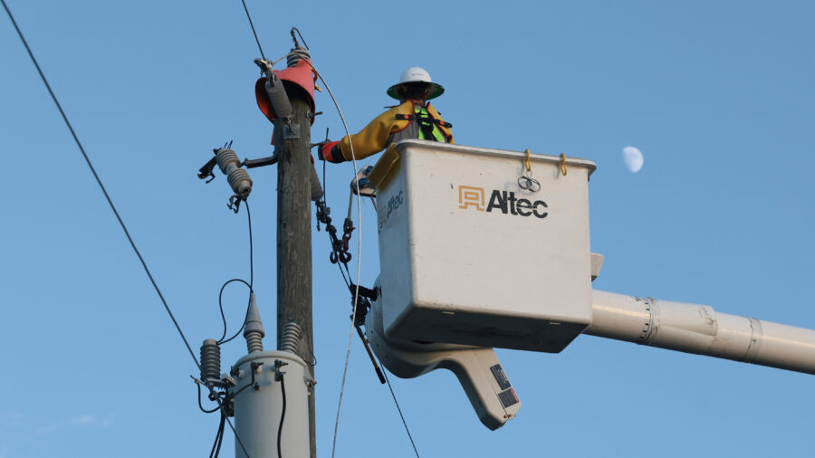 A utility worker with Florida Power & Light services a transformer in Punta Gorda, Fla., on Oct. 12, 2024. Credit: Thomas O'Neill/NurPhoto via Getty Images