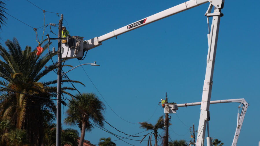 Utility workers repair power lines after Hurricane Milton passed through the area on Oct. 12, 2024, in Englewood, Fla. Credit: Joe Raedle/Getty Images
