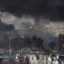Plumes of smoke rise over oil depot tanks hit by a joint Israel-U.S. attack on March 8 in Tehran, Iran. Credit: Kaveh Kazemi/Getty Images