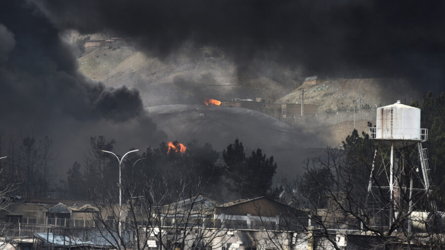 Plumes of smoke rise over oil depot tanks hit by a joint Israel-U.S. attack on March 8 in Tehran, Iran. Credit: Kaveh Kazemi/Getty Images