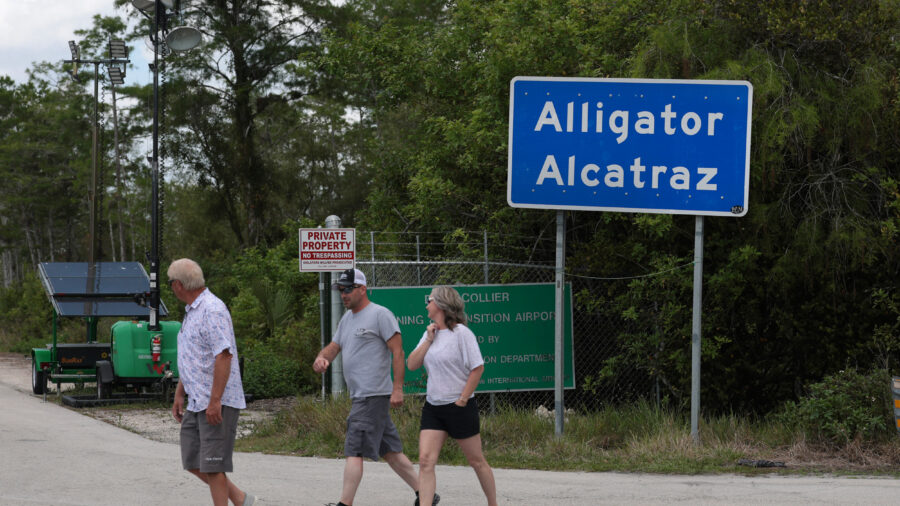 People walk near the front entrance to Alligator Alcatraz in the Florida Everglades on April 22. Credit: Joe Raedle/Getty Images