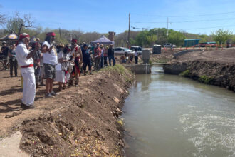 Community members participate in a blessing ceremony at Atrisco Acequia Madre in Albuquerque, New Mexico. Credit: Tina Deines/Inside Climate News