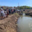Community members participate in a blessing ceremony of the Atrisco Acequia Madre in Albuquerque, N.M. Credit: Tina Deines/Inside Climate News