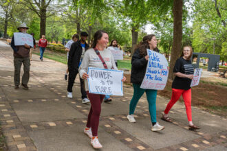 Protestors march from Birmingham's Kelly Ingram Park toward Alabama Power’s Birmingham headquarters on Monday. Credit: Lee Hedgepeth/Inside Climate News