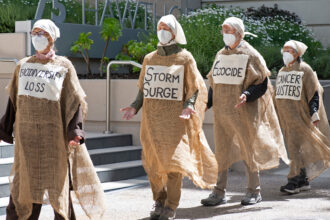 “Lamentors” wear sackcloth and ash, mourning the Trump administration’s decision to overturn a landmark climate regulation rule, outside EPA Region 9 headquarters in San Francisco on Tuesday. Credit: ProBonoPhoto.org/Rachel Podlishevsky