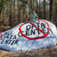 Kim Hicks paints a message opposing a proposed data center onto a neighborhood rock near the Project Ruby site in Muscogee County, Ga., part of a growing grassroots effort against the development. Credit: Courtesy of Kim Hicks