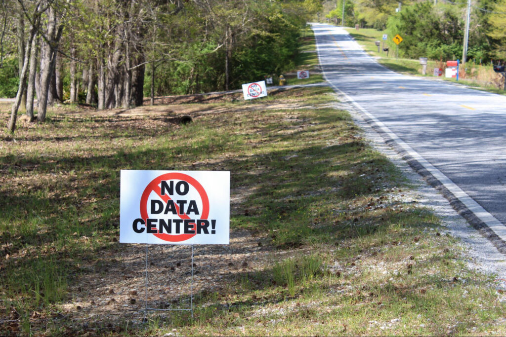 “No Data Center” signs appear along roads in Muscogee County, Ga., as residents organize against the proposed Project Ruby development. Credit: Jade Yeban/Inside Climate News