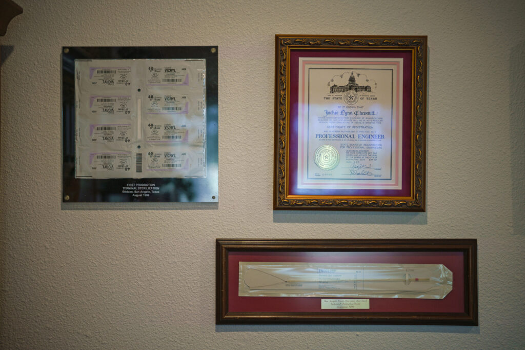 A certificate showing Jackie Chesnutt’s registration as a professional engineer sits next to other relics from her career in her home office.