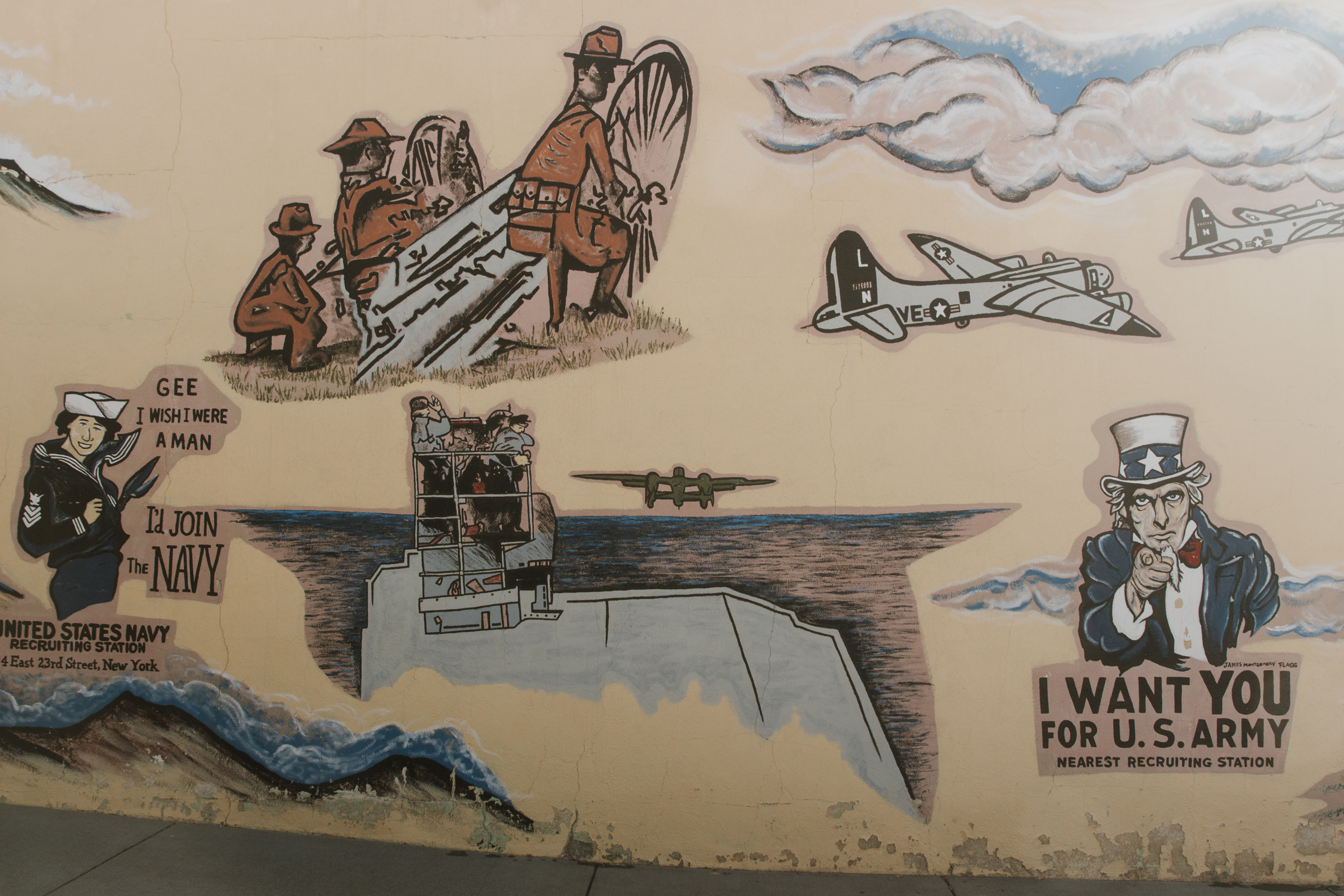 A mural on a military recruiting facility in the historic mining town of Custer, in the center of the Black Hills, features imagery that echoes and celebrates narratives of American expansion, patriotism and military power. Credit: Carla Samon Ros/CJI