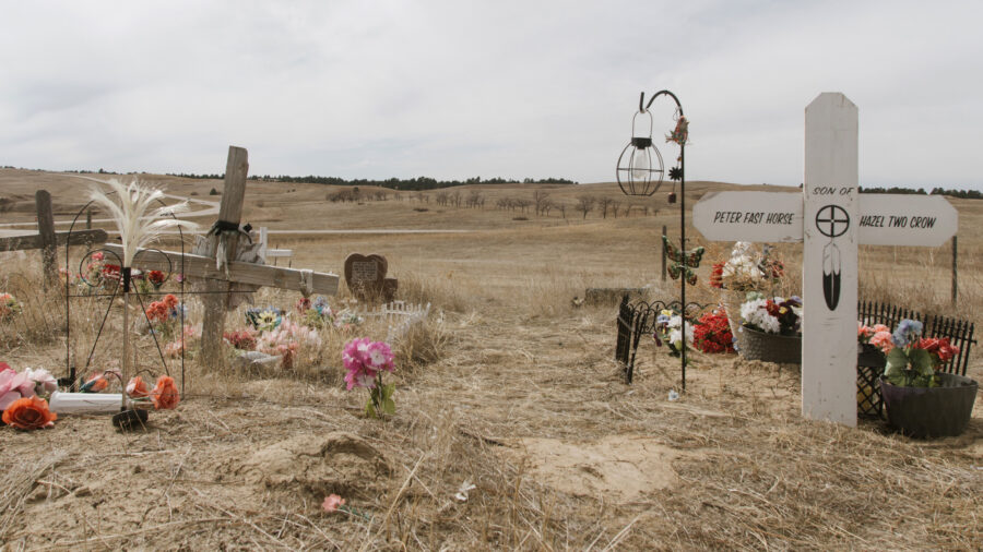 Graves mark the site of the 1890 Wounded Knee Massacre on the Pine Ridge Reservation in South Dakota, where U.S. troops killed more than 250 Lakota men, women and children. Credit: Carla Samon Ros/CJI