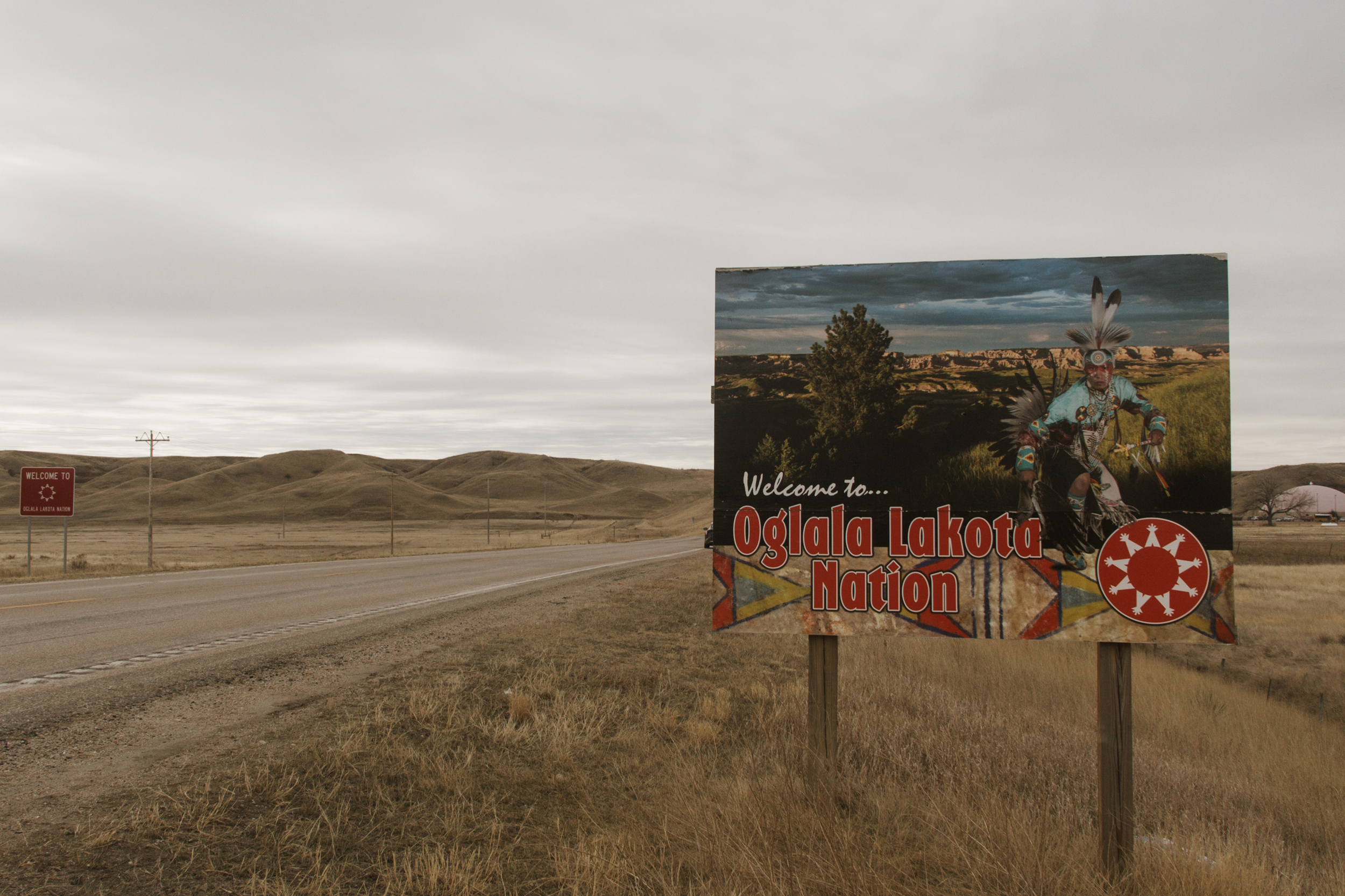 A roadside sign marks the entrance to the Oglala Lakota Nation on South Dakota’s Pine Ridge Reservation, southeast of the Black Hills. Credit: Carla Samon Ros/CJI