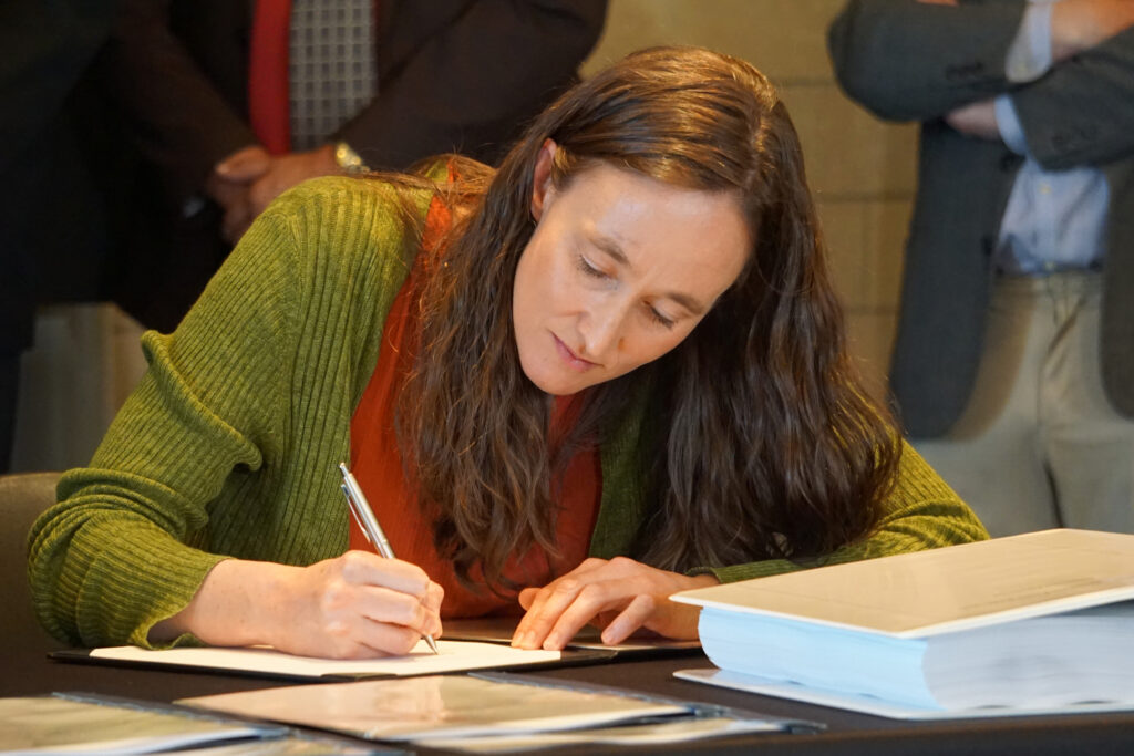 Seattle Mayor Katie B. Wilson signed a $1.35 billion agreement Tuesday with three Skagit River tribes, saying the city now views them as “essential partners” in the future of the river and its habitat. Credit: Blaine Harden/Inside Climate News