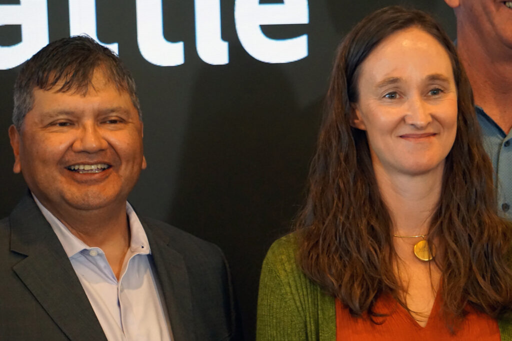 After nearly a decade of hard-fought negotiations, Scott Schuyler of the Upper Skagit Indian Tribe joined Seattle Mayor Katie B. Wilson on Tuesday for the signing of a settlement creating fish passage around the city’s dams on the Skagit River. Credit: Blaine Harden/Inside Climate News